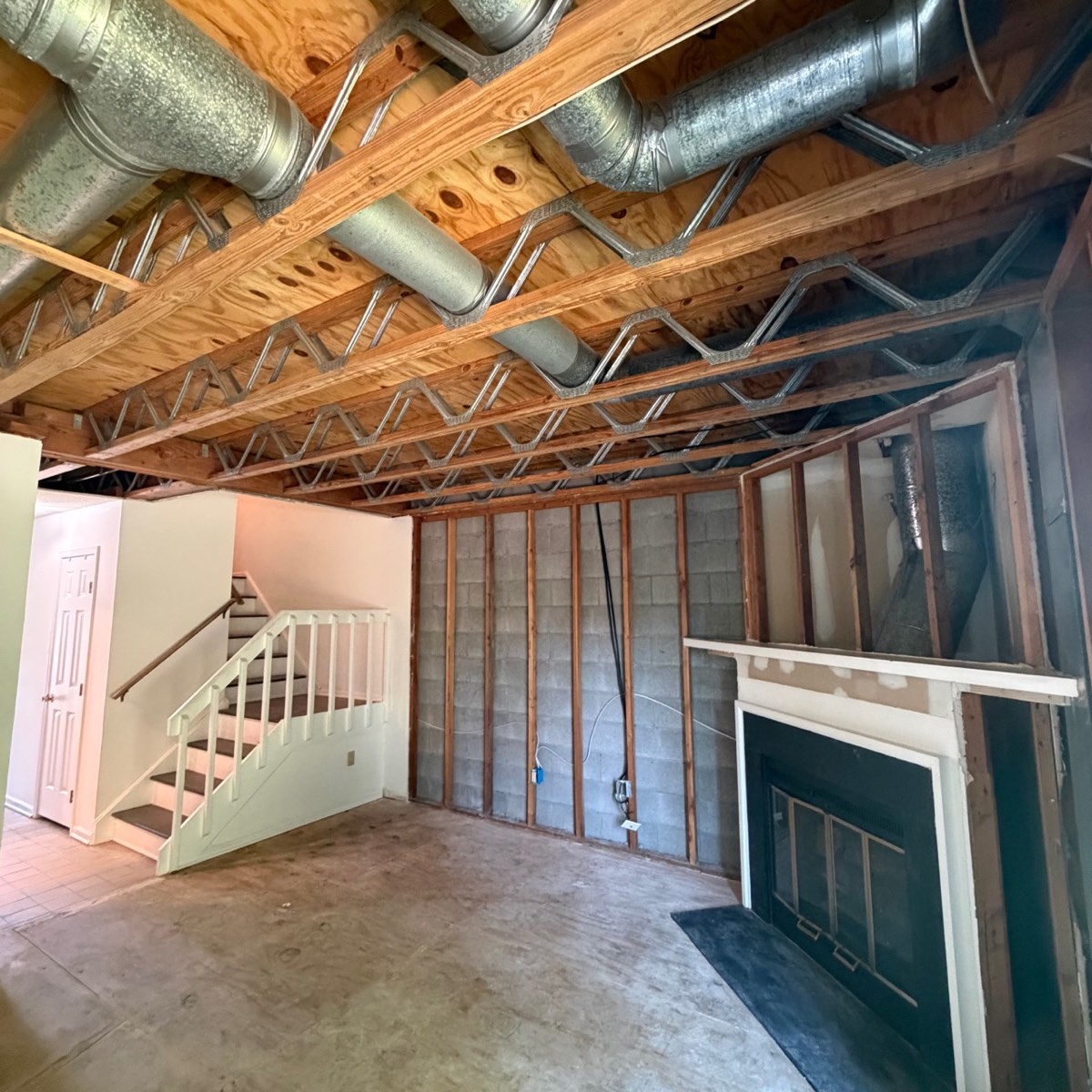 Before photo of exposed living room ceiling framing before drywall installation in Shelton CT