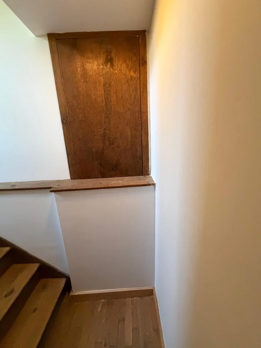 After photo of stairwell drywall repair and finished access panel by KPX in Ridgefield CT